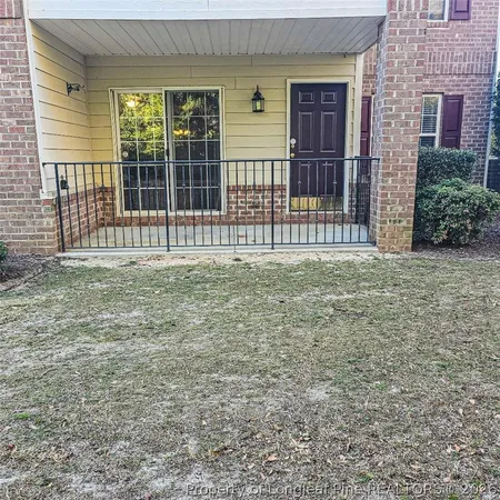 a view of a backyard that has two large trees