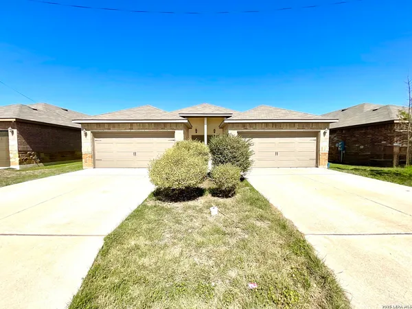 a view of a backyard of the house