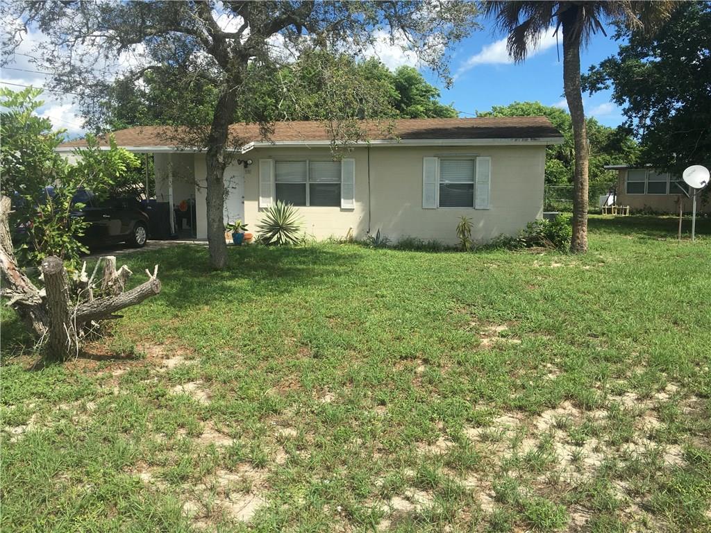 330 6th Road Southwest Vero Beach, FL 32962 - Photo 1 of 7 a view of a house with a backyard