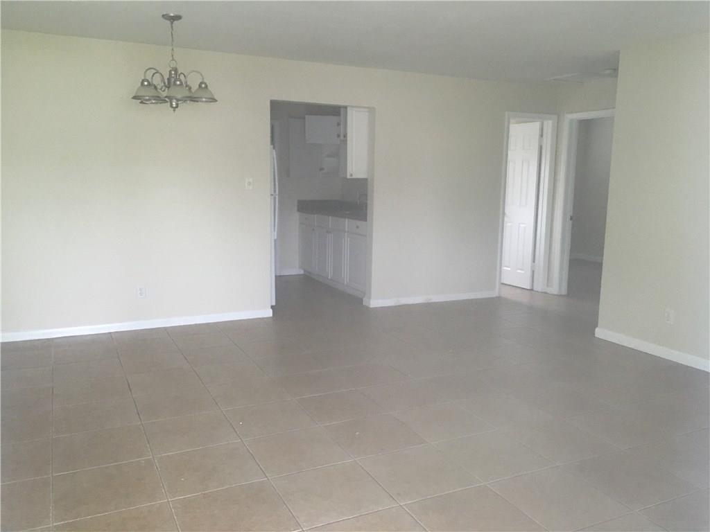 330 6th Road Southwest Vero Beach, FL 32962 - Photo 2 of 7 an empty room with windows and closet