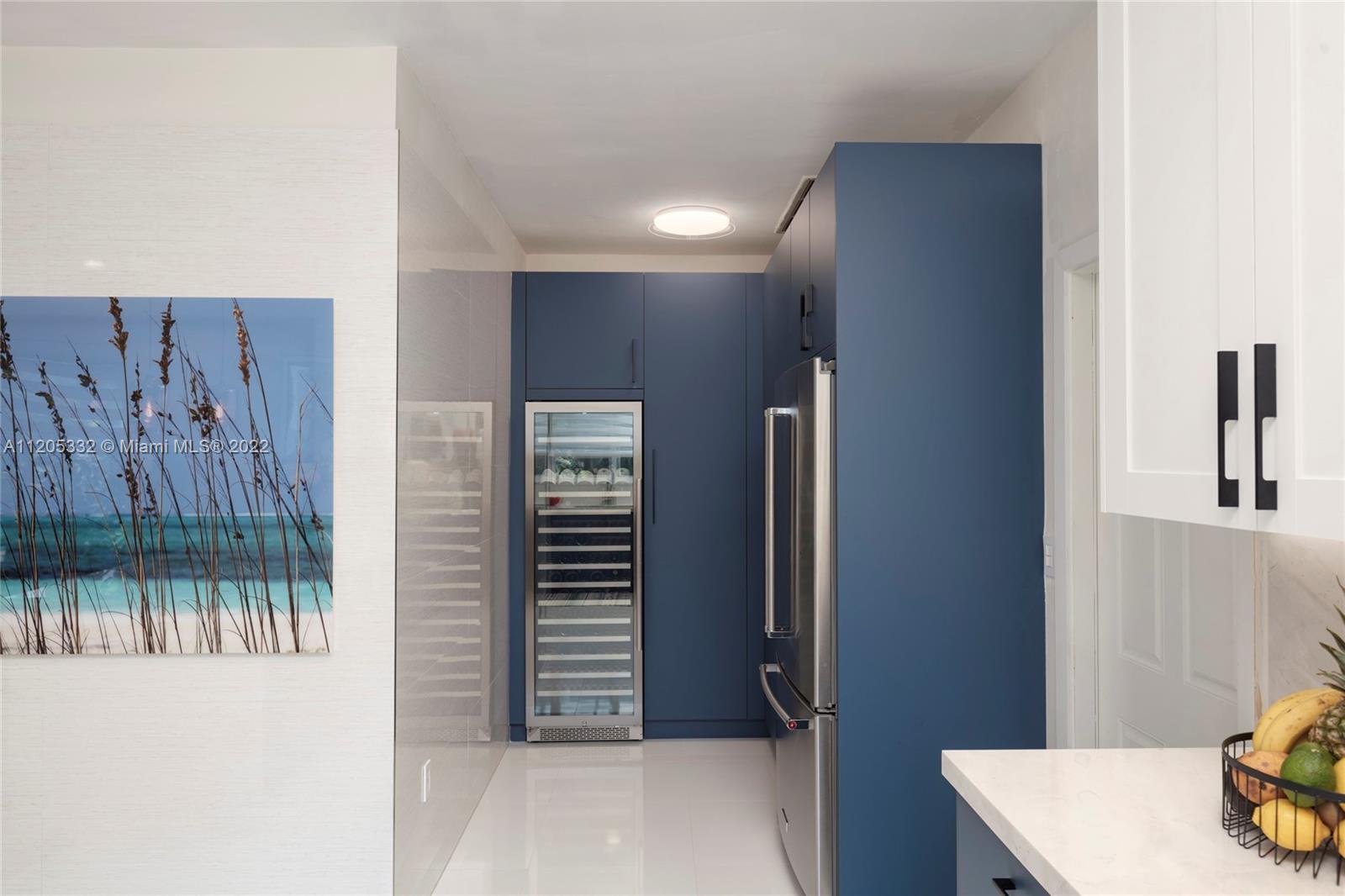 9 Pinta Road Miami, FL 33133 - Photo 11 of 25 a view of a hallway with a cabinet and a window