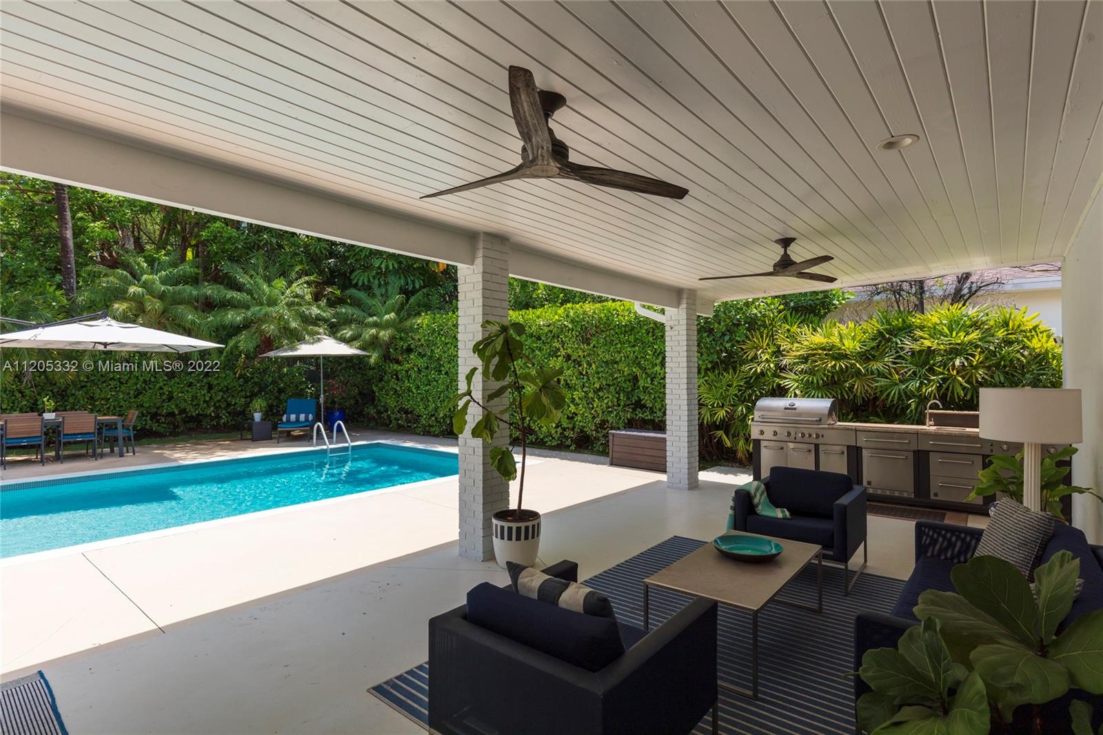 9 Pinta Road Miami, FL 33133 - Photo 12 of 25 a patio with yard table and chairs