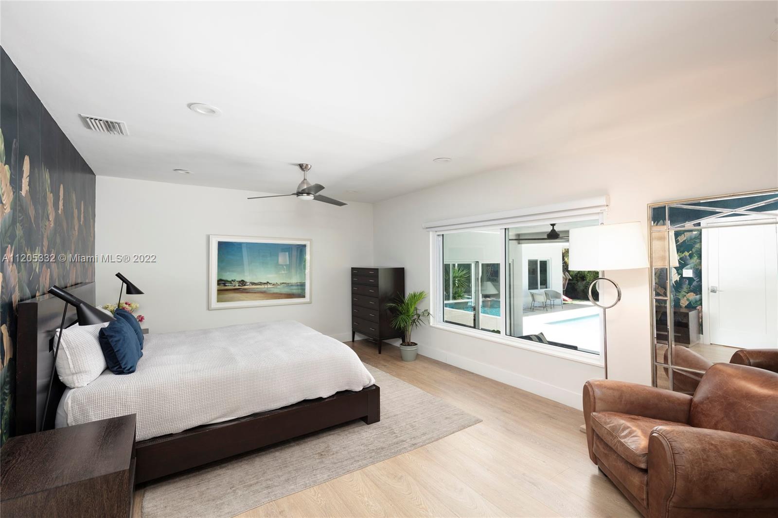 9 Pinta Road Miami, FL 33133 - Photo 13 of 25 a bedroom with a bed couch and a large window