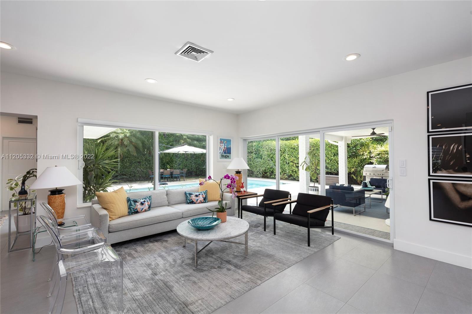 9 Pinta Road Miami, FL 33133 - Photo 4 of 25 a living room with furniture and a large window