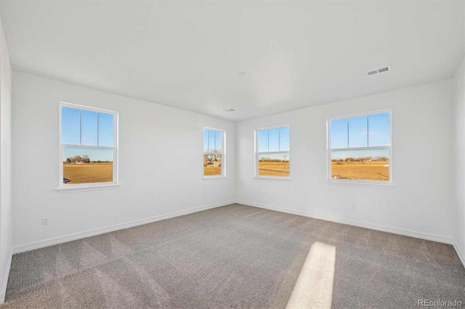 1162 Weller Street Timnath, CO 80547 - Photo 15 of 29 a view of an empty room with a window