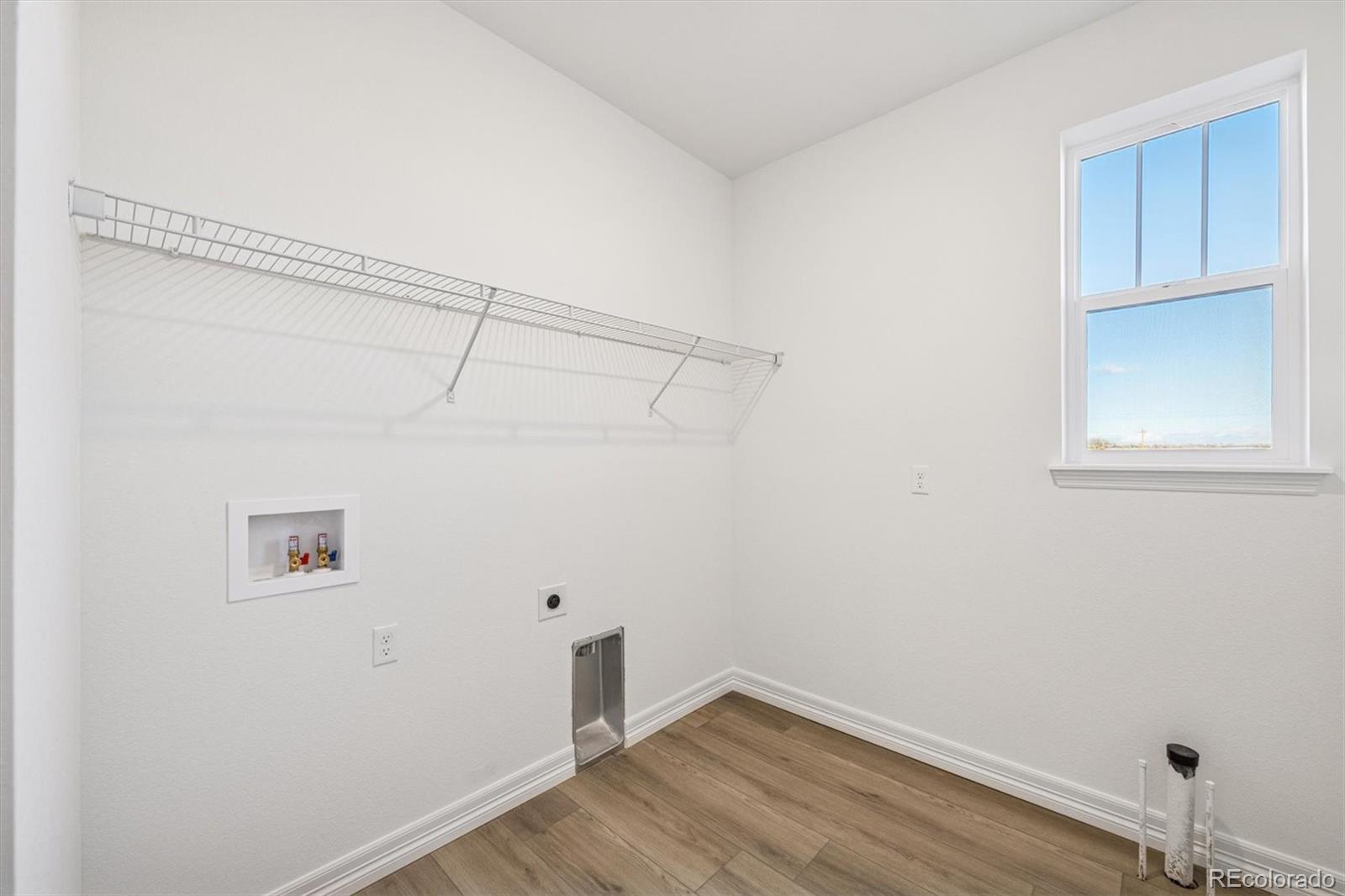 1162 Weller Street Timnath, CO 80547 - Photo 18 of 29 a view of a small space with wooden floor and cabinet