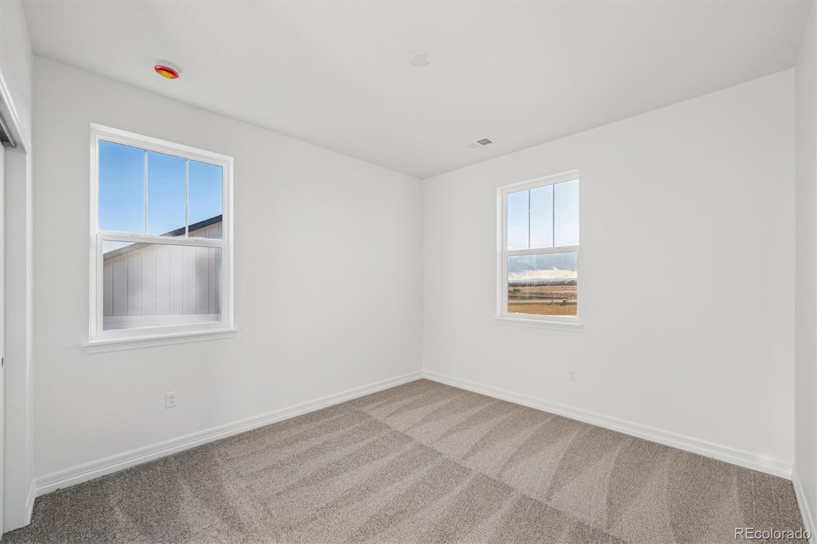1162 Weller Street Timnath, CO 80547 - Photo 21 of 29 an empty room with a window