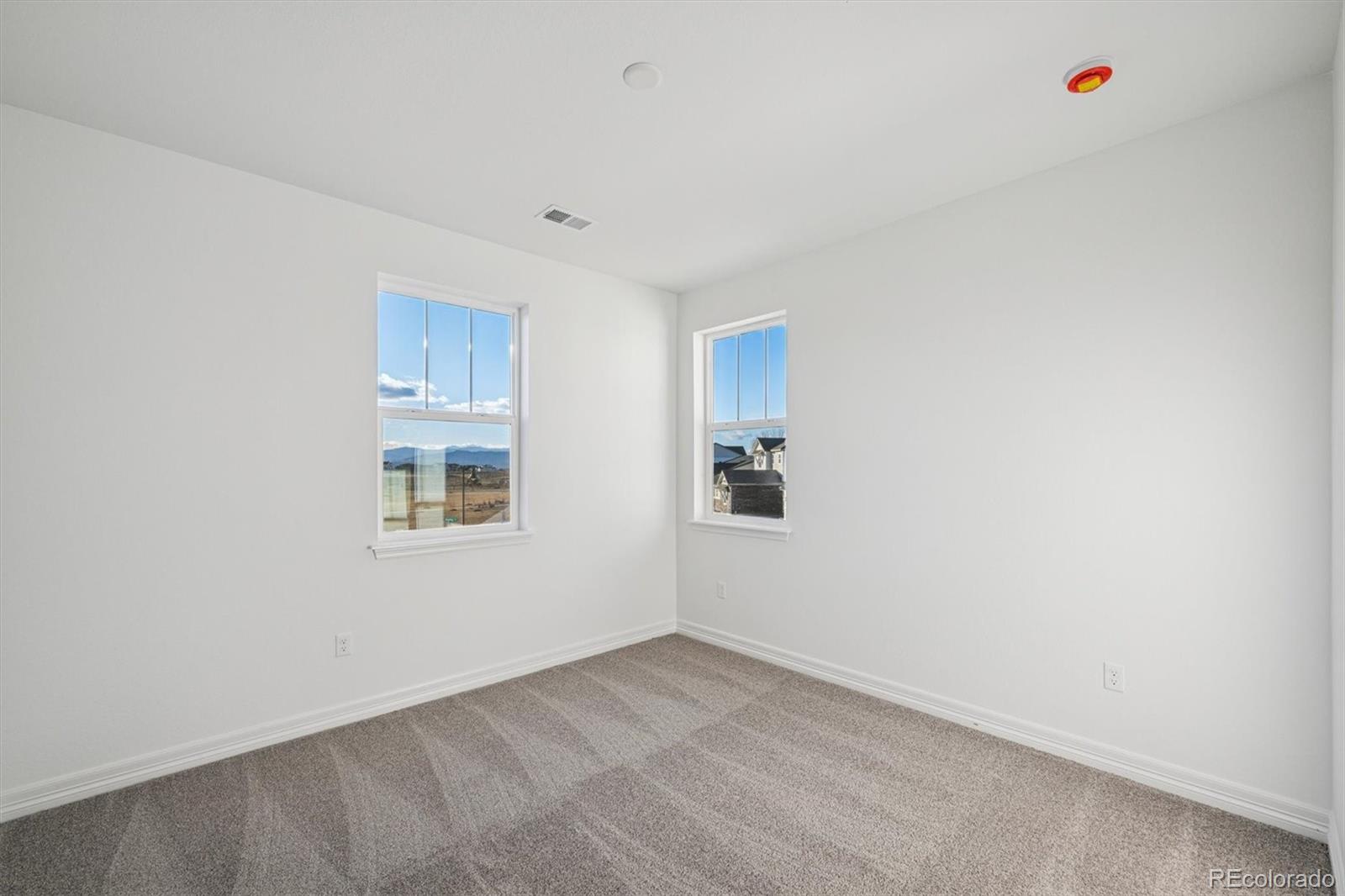 1162 Weller Street Timnath, CO 80547 - Photo 22 of 29 a view of an empty room with a window