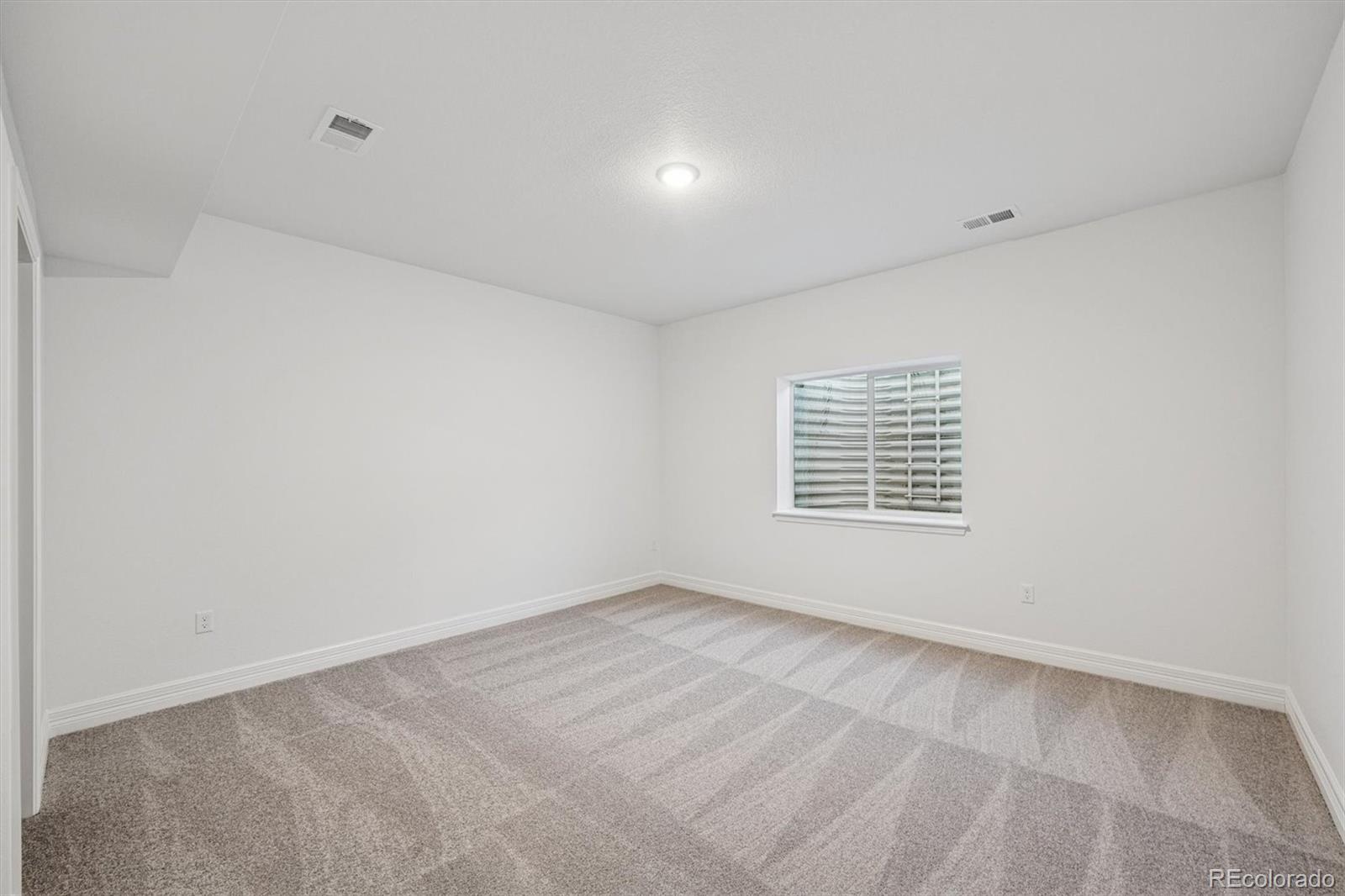 1162 Weller Street Timnath, CO 80547 - Photo 25 of 29 a view of an empty room with a window