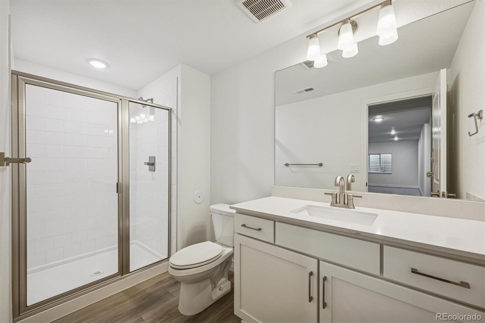 1162 Weller Street Timnath, CO 80547 - Photo 26 of 29 a bathroom with a sink a toilet and shower