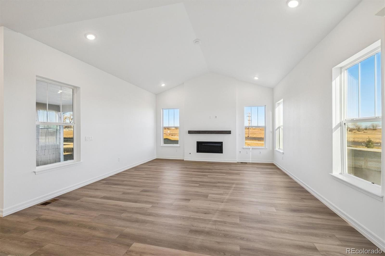 1162 Weller Street Timnath, CO 80547 - Photo 9 of 29 a view of empty room with kitchen and window
