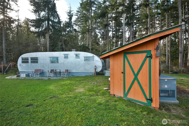 a view of a swimming pool and a yard