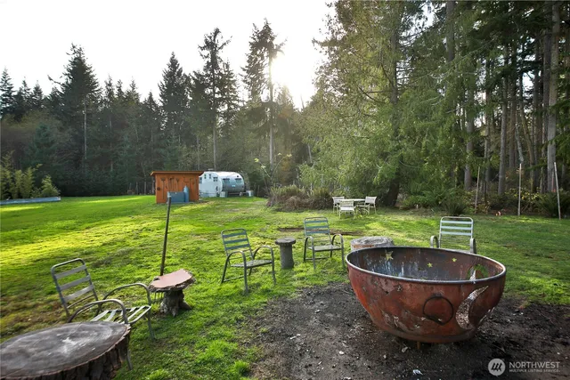a backyard of a house with outdoor seating