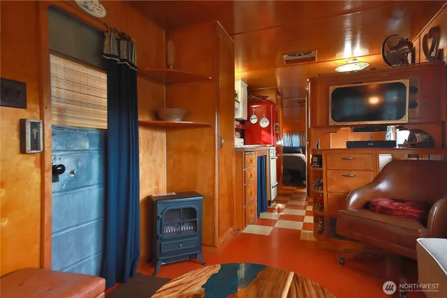 a kitchen with a stove top oven and cabinets