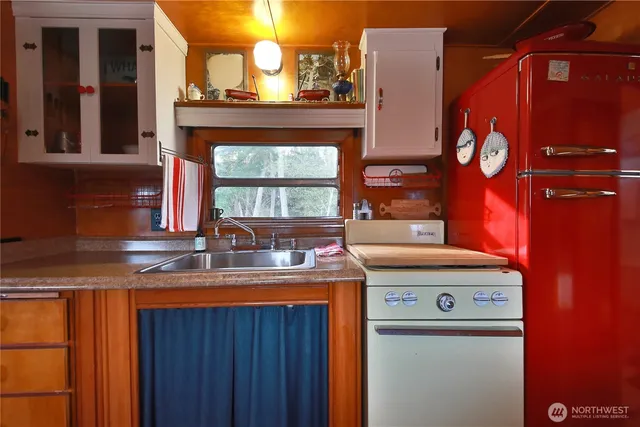 a dining room with furniture and a window