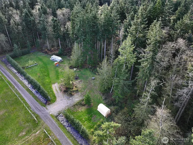 a view of a lake with a yard