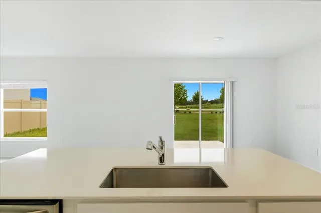 a view of a sink and a window