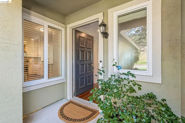 a bathroom with a toilet a sink and a mirror