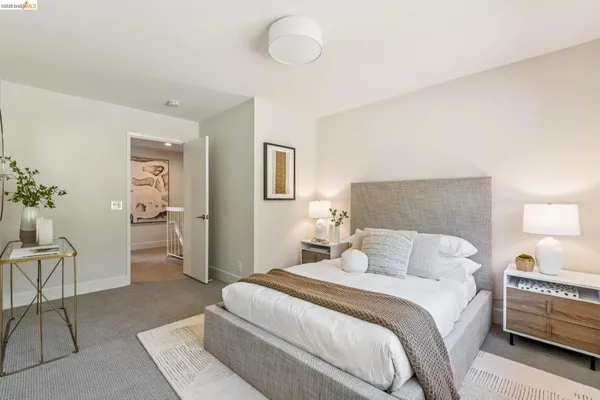 a bedroom with a bed and a couch