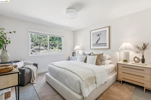 a bedroom with bed and a window