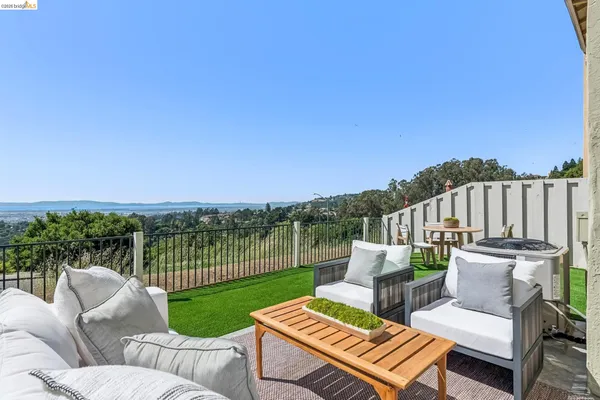 a view of a patio with couches and a table and chairs
