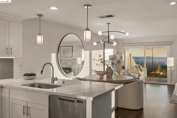 a kitchen with a sink and a wooden floor