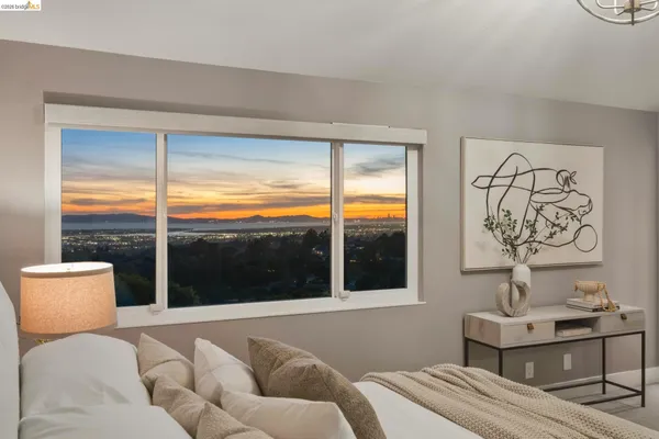 a bedroom with furniture and a window