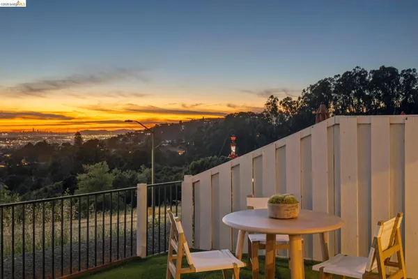 a view of a chairs and table in patio