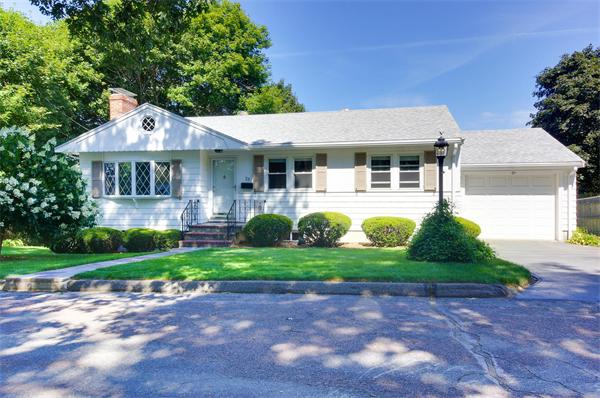 23 Jeffrey Road Arlington, MA 02474 - Photo 1 of 18 a front view of a house with a garden and plants