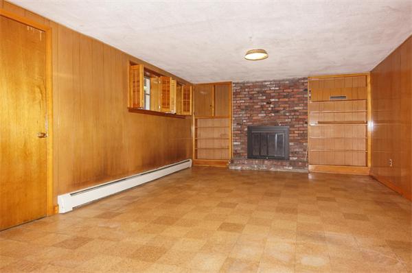 23 Jeffrey Road Arlington, MA 02474 - Photo 13 of 18 an empty room with a fireplace