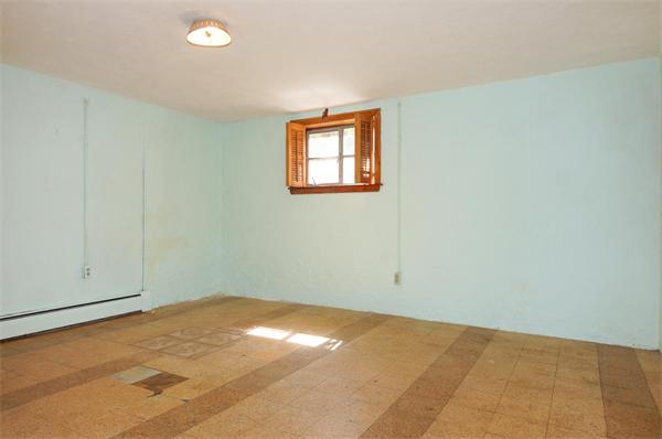 23 Jeffrey Road Arlington, MA 02474 - Photo 15 of 18 an empty room with a workbench