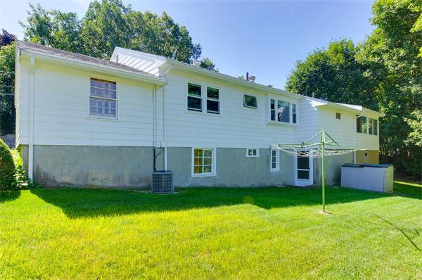 23 Jeffrey Road Arlington, MA 02474 - Photo 2 of 18 a view of a house with backyard and a tree