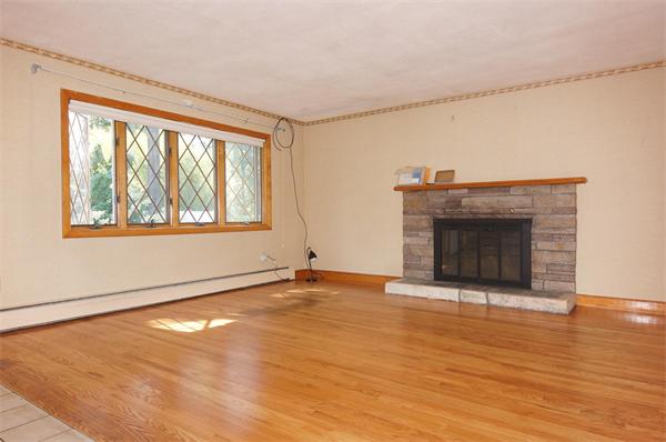 23 Jeffrey Road Arlington, MA 02474 - Photo 4 of 18 a view of an empty room with wooden floor and a window