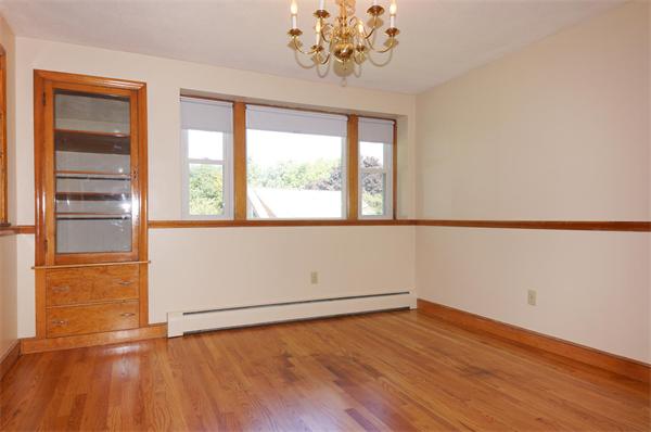 23 Jeffrey Road Arlington, MA 02474 - Photo 5 of 18 an empty room with wooden floor and windows