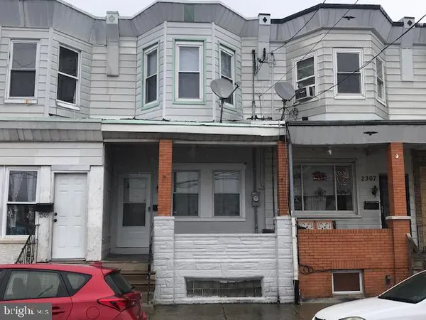 a view of a building with a car parked