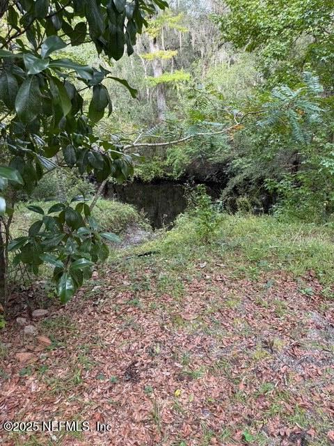 a view of outdoor space and a lake view