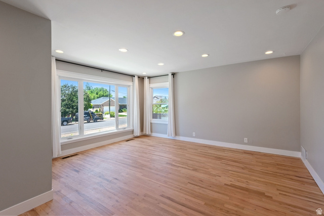 1214 North 300 West Mapleton, UT 84664 - Photo 6 of 33 Spacious living room featuring wood-finish flooring, recessed lighting, and expansive windows