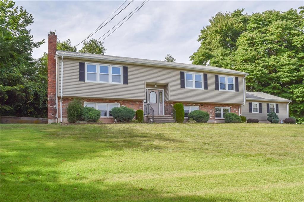152 Country Hills Road Hamden, CT 06514 - Photo 1 of 1 a front view of a house with a yard