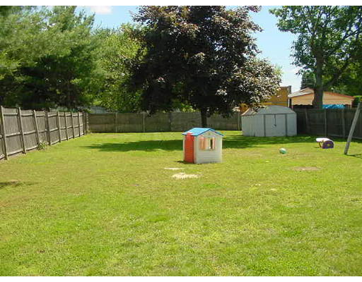 3 Alice Street Montague, MA 01376 - Photo 6 of 6 a backyard of a house with barbeque oven