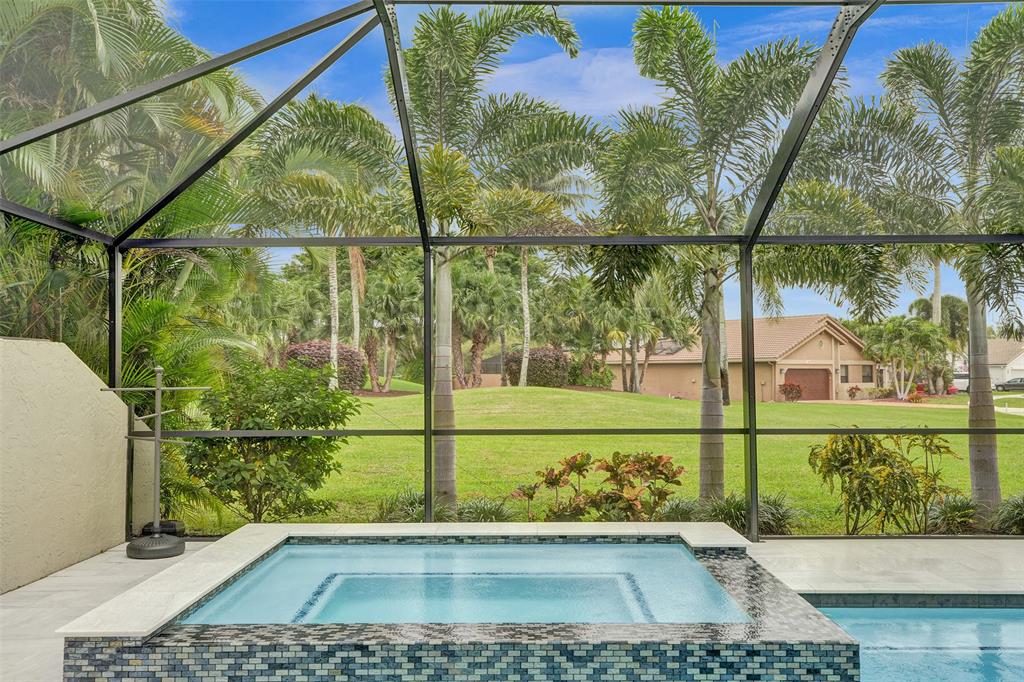 21357 Bridgeview Drive Boca Raton, FL 33428 - Photo 12 of 54 a view of a yard with wooden fence