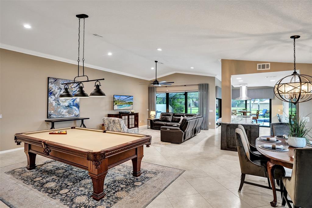 21357 Bridgeview Drive Boca Raton, FL 33428 - Photo 14 of 54 a living room with furniture a window and gym equipment