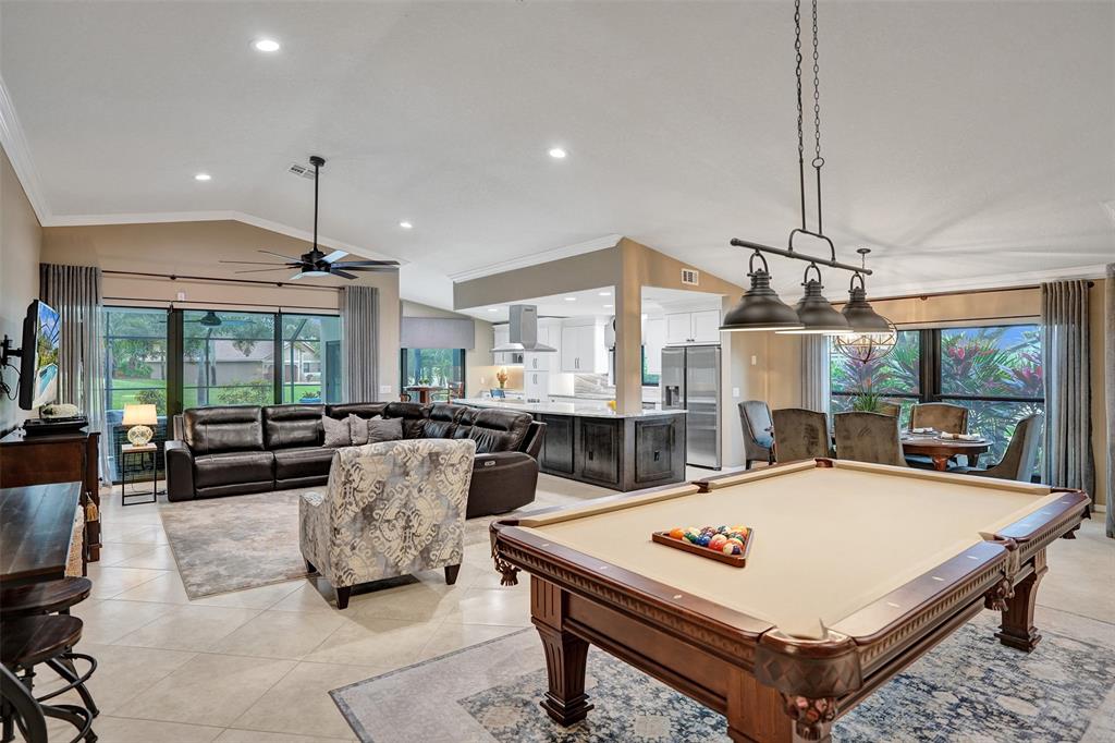 21357 Bridgeview Drive Boca Raton, FL 33428 - Photo 15 of 54 a living room with furniture a table and chairs