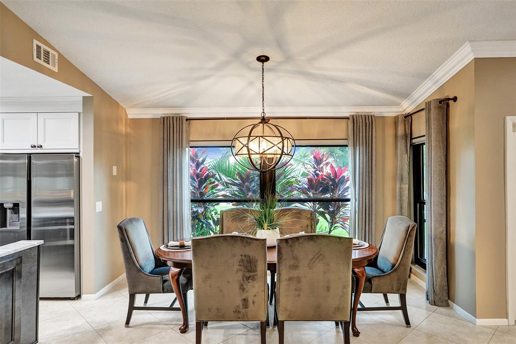 21357 Bridgeview Drive Boca Raton, FL 33428 - Photo 17 of 54 a view of a dining room with furniture window and outside view