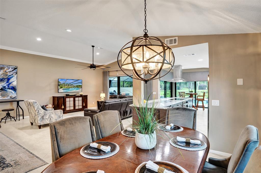 21357 Bridgeview Drive Boca Raton, FL 33428 - Photo 18 of 54 a living room with furniture a window and kitchen view