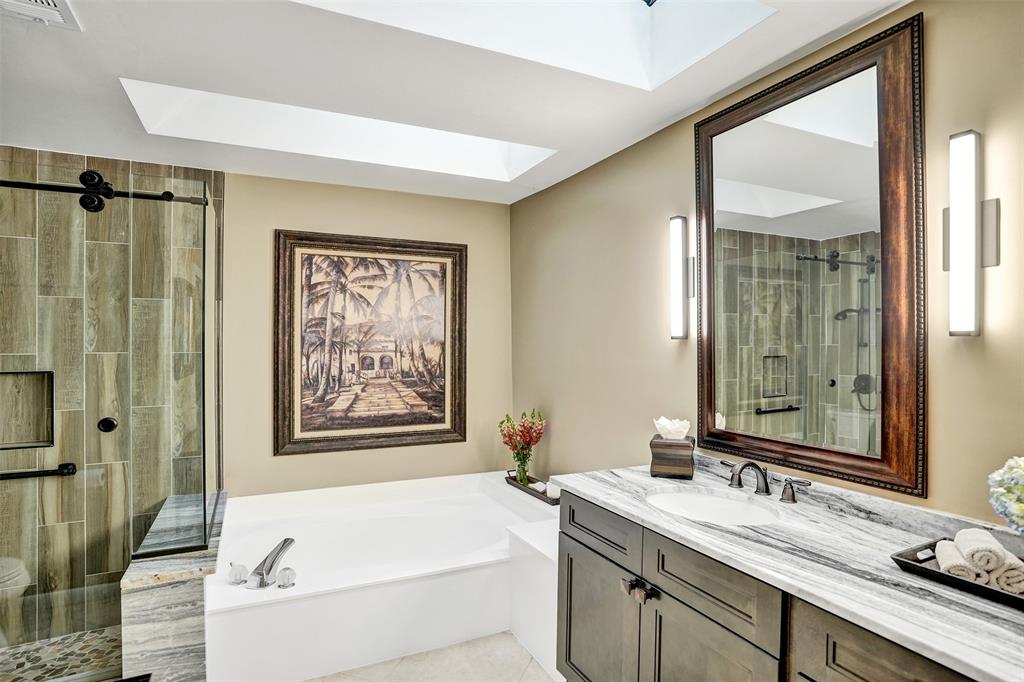 21357 Bridgeview Drive Boca Raton, FL 33428 - Photo 31 of 54 a bathroom with a granite countertop sink mirror toilet and bathtub