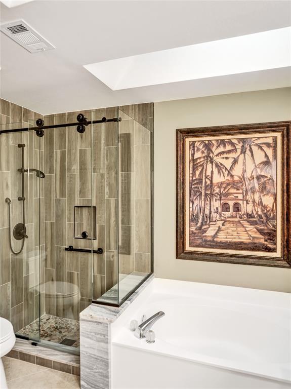 21357 Bridgeview Drive Boca Raton, FL 33428 - Photo 33 of 54 a bathroom with a bathtub and shower