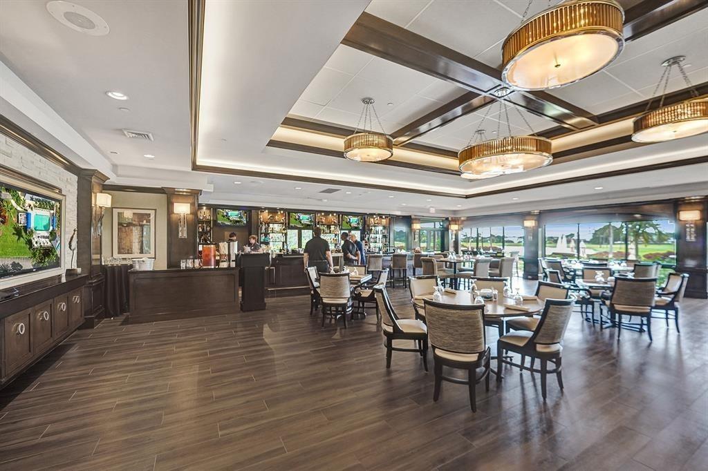 21357 Bridgeview Drive Boca Raton, FL 33428 - Photo 50 of 54 a view of a dining room with furniture window and wooden floor