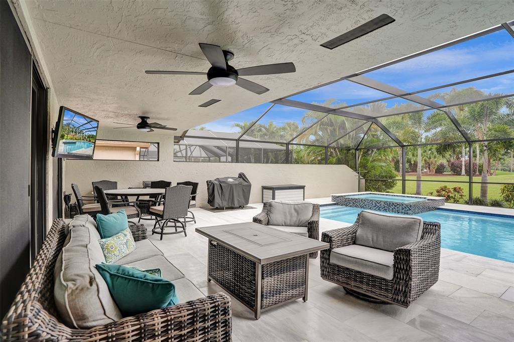 21357 Bridgeview Drive Boca Raton, FL 33428 - Photo 8 of 54 a living room with furniture and a large window