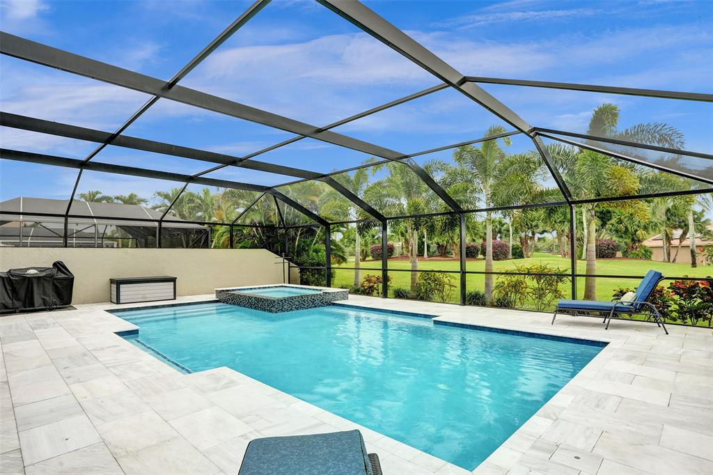 21357 Bridgeview Drive Boca Raton, FL 33428 - Photo 10 of 54 a view of a swimming pool with a porch