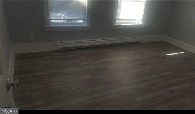 a kitchen with granite countertop white cabinets and sink